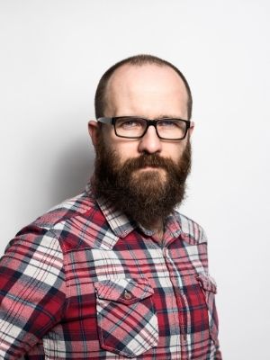 bald man with full beard and glasses