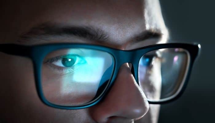 computer screen light reflecting off glasses