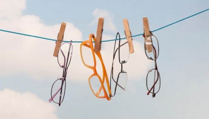 eyeglasses hanging on a clothesline