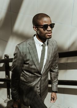 man in suit and browline sunglasses