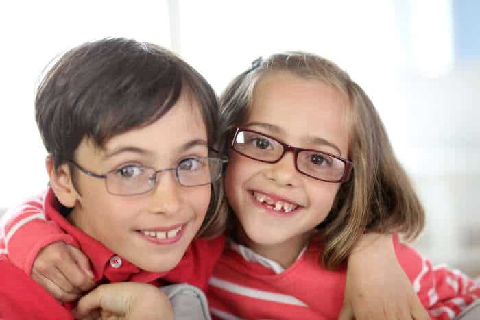 boy and girl wearing glasses