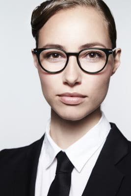 business woman with round glasses