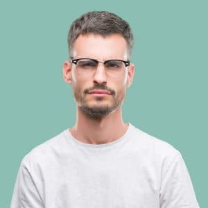 frowning man with browline glasses