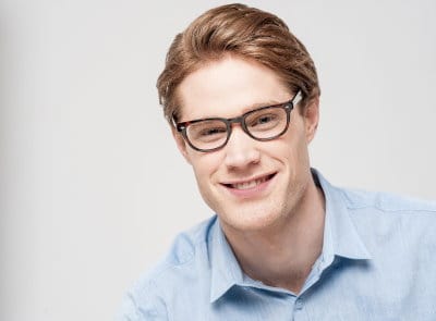 young man with glasses that are too small