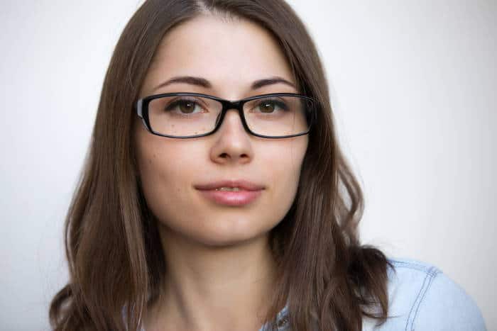 young woman wearing rectangle glasses