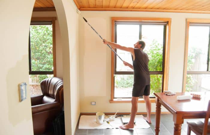 man doing diy paint job at home