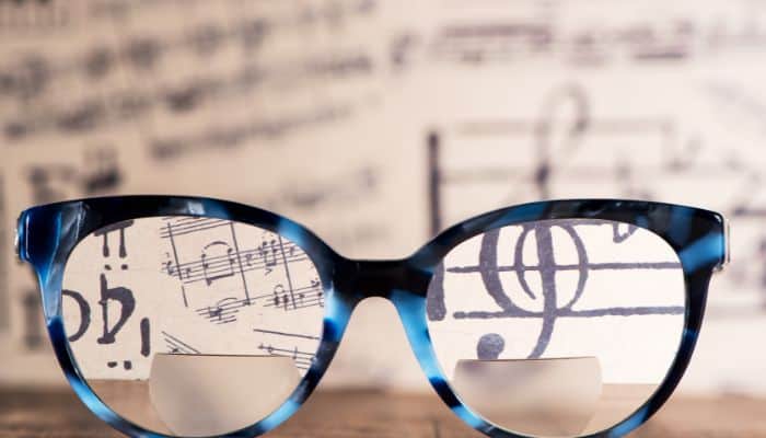 bifocals with musical score in background