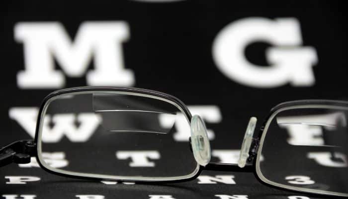 trifocal glasses with eye chart in background