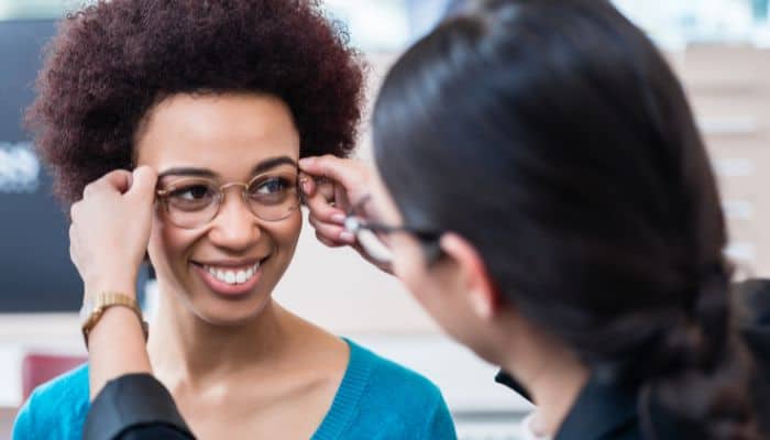 woman getting fitted with single-vision glasses