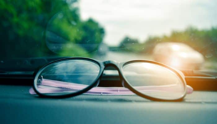 eyeglasses on car dashboard