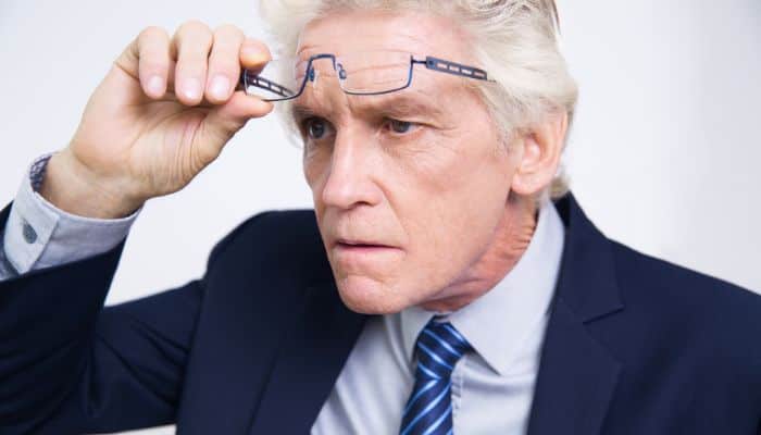man who sees better with glasses off