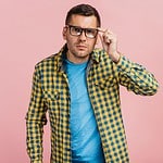 man in checkered shirt and eyeglasses