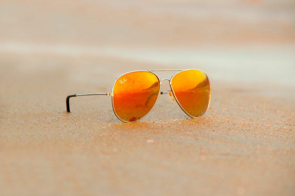 ray-ban aviator sunglasses on beach