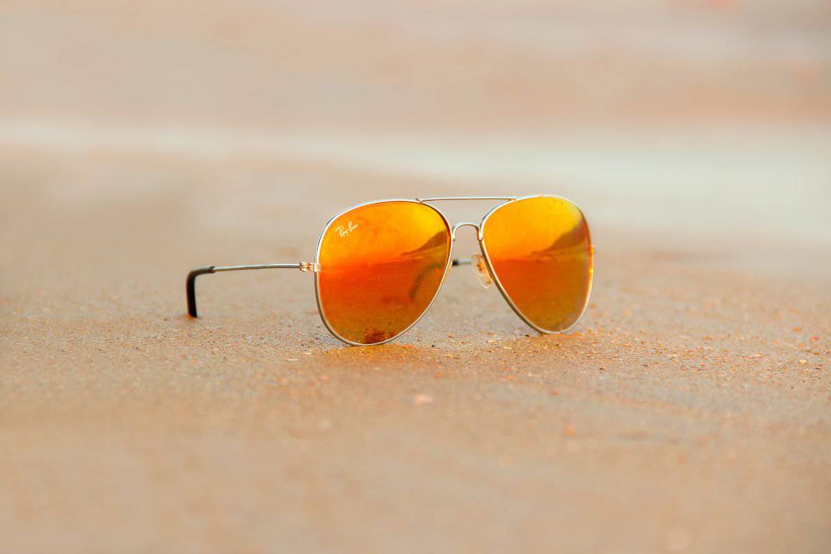 ray-ban aviator sunglasses on beach