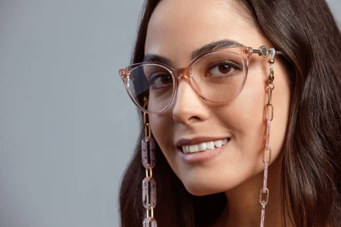 woman wearing glasses with chain