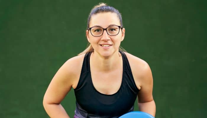active woman with full rim eyeglasses