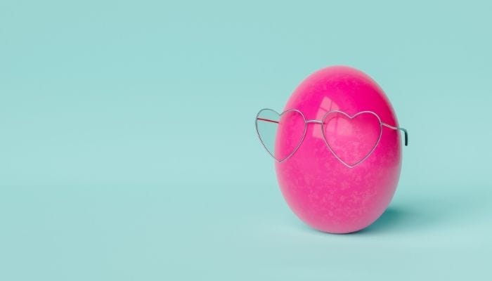 heart shaped metal glasses on pink egg