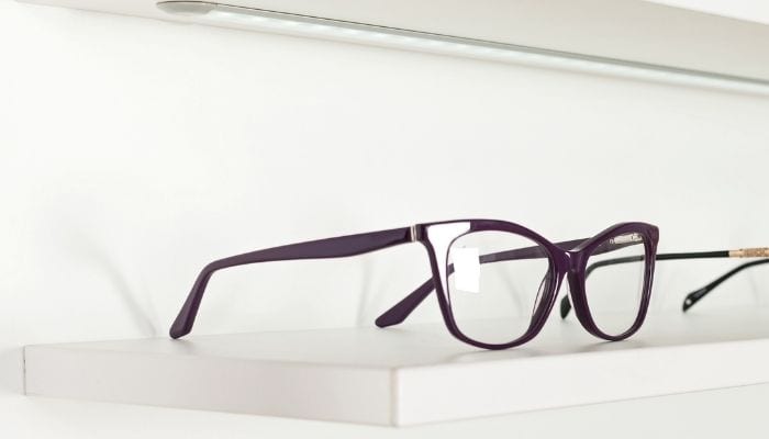 purple cat eyeglasses on display