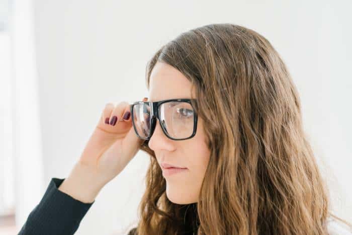 woman wearing black flat top glasses