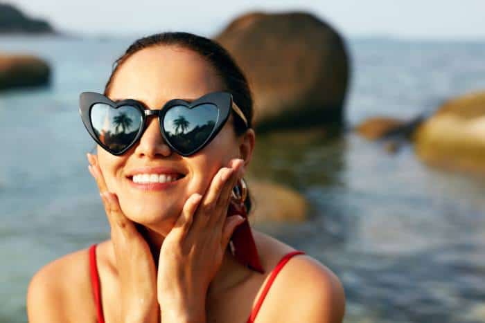 woman in oversize heart sunglasses