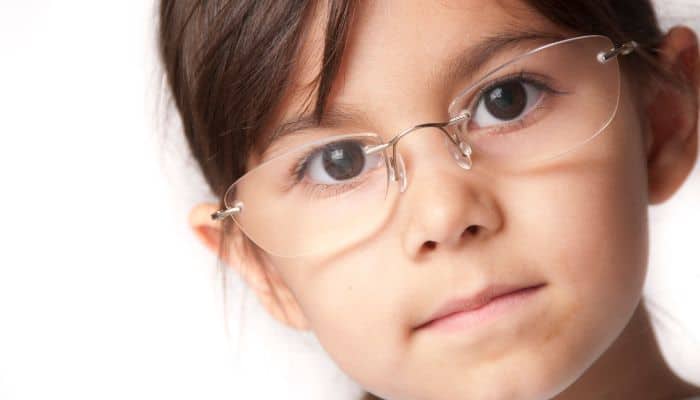 young girl wearing rimless glasses