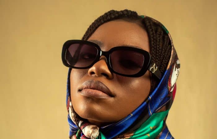 woman with a low nose bridge wearing stylish sunglasses